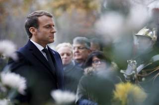 French President Emmanuel Macron stands at attention after laying a wreath in front of the statue of Georges Clemenceau during the Armistice Day commemorations marking the end of World War I in Paris, France, November 11, 2017. REUTERS/Francois Guillot/Po