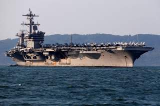 U.S. Navy aircraft carrier, USS Carl Vinson, docks at a port in Danang, Vietnam March 5, 2018. REUTERS/Kham