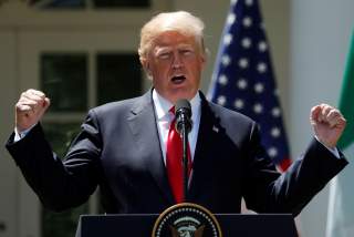 U.S. President Donald Trump gestures while addressing a joint news conference with Nigeria's President Muhammadu Buhari in the Rose Garden of the White House in Washington, U.S., April 30, 2018.