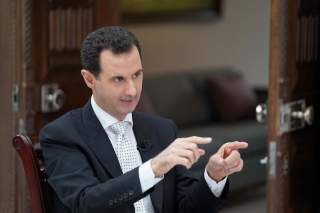 Syria's President Bashar al Assad gestures during an interview with a Greek newspaper in Damascus, Syria in this handout released May 10, 2018. SANA/Handout via Reuters 