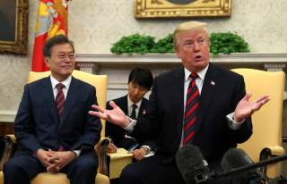 U.S. President Donald Trump gestures as he welcomes South Korea's President Moon Jae-In in the Oval Office of the White House in Washington, U.S., May 22, 2018. REUTERS/Kevin Lamarque