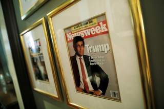 A framed Newsweek magazine cover of U.S. President Donald Trump hangs on the wall of the Trump National Golf Club Bedminster clubhouse in Berkeley Heights, New Jersey, U.S., August 9, 2018. REUTERS/Carlos Barria