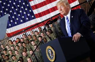 U.S. Army 10th Mountain Division troops listen as President Donald Trump speaks before signing the National Defense Authorization Act at Fort Drum, New York, U.S., August 13, 2018. REUTERS/Carlos Barria