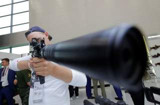 A participant holds a rifle during the annual international military-technical forum 