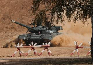 A Russian T-80 U tank drives during the annual international military-technical forum 