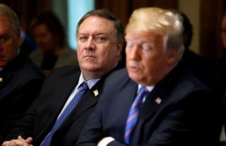 U.S. Secretary of State Mike Pompeo listens as President Donald Trump speaks during a cabinet meeting at the White House in Washington, U.S., July 18, 2018. REUTERS/Leah Millis/File Photo