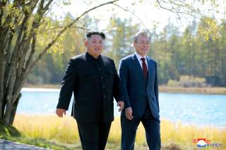 South Korean President Moon Jae-in and North Korean leader Kim Jong Un walk during a luncheon, in this photo released by North Korea's Korean Central News Agency (KCNA) on September 21, 2018. KCNA via REUTERS ATTENTION EDITORS - THIS IMAGE WAS PROVIDED BY