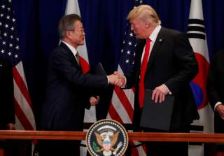 South Korean President Moon Jae-in shakes hands with U.S. President Donald Trump after they signed the U.S.-Korea Free Trade Agreement on the sidelines of the 73rd United Nations General Assembly in New York, U.S., September 24, 2018. REUTERS/Carlos Barri