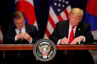 U.S. President Donald Trump and South Korean President Moon Jae-in sign the U.S.-Korea Free Trade Agreementon during a ceremony on the sidelines of the 73rd United Nations General Assembly in New York, U.S., September 24, 2018. REUTERS/Carlos Barria