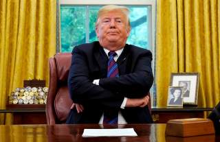 U.S. President Donald Trump sits behind his desk as he announces a bilateral trade agreement with Mexico to replace the North American Free Trade Agreement (NAFTA) at the White House in Washington, U.S., August 27, 2018. REUTERS/Kevin Lamarque/File Photo