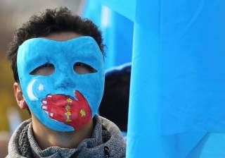 A man takes part in a demonstration against China during its Universal Periodic Review by the Human Rights Council in front of the United Nations Office in Geneva, Switzerland, November 6, 2018. REUTERS/Denis Balibouse