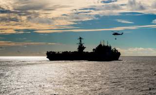 The Nimitz-class aircraft carrier USS John C. Stennis conducts a replenishment-at-sea with the dry cargo and ammunition ship USNS Charles Drew November 13, 2018. Picture taken November 13, 2018. Courtesy Nick Bauer/U.S. Navy/Handout via REUTERS ATTENTION 