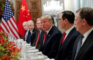 U.S. President Donald Trump, U.S. President Donald Trump's national security adviser John Bolton, U.S. Treasury Secretary Steven Mnuchin attend a working dinner with Chinese President Xi Jinping after the G20 leaders summit in Buenos Aires, Argentina Dece