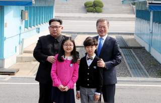 FILE PHOTO : South Korean President Moon Jae-in and North Korean leader Kim Jong Un attend a welcoming ceremony in the truce village of Panmunjom inside the demilitarized zone separating the two Koreas, South Korea, April 27, 2018. Korea Summit Press Pool