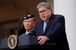 U.S. Attorney General Bill Barr describes the Trump administration's effort to gain citizenship data during the 2020 census as Commerce Secretary Wilbur Ross stands at his side during an event with the president in the Rose Garden of the White House