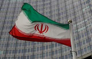 An Iranian flag flutters in front of the International Atomic Energy Agency (IAEA) headquarters in Vienna, Austria September 9, 2019. REUTERS/Leonhard Foeger