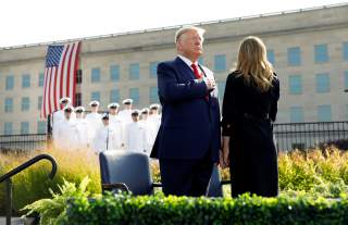 U.S. President Donald Trump and first lady Melania Trump attend a ceremony marking the 18th anniversary of September 11 attacks at the Pentagon in Arlington, Virginia, U.S., September 11, 2019. REUTERS/Kevin Lamarque