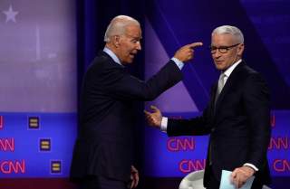 Democratic 2020 U.S. presidential candidate and former Vice President Joe Biden reacts next to moderator CNN's Anderson Cooper during a televised townhall on CNN dedicated to LGBTQ issues in Los Angeles, California, U.S. October 10, 2019. REUTERS/Mike Bla