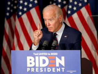 Democratic 2020 U.S. presidential candidate and former Vice President Joe Biden gestures as he speaks at a campaign town hall meeting in Rochester, New Hampshire, U.S., October 9, 2019. REUTERS/Mary Schwalm
