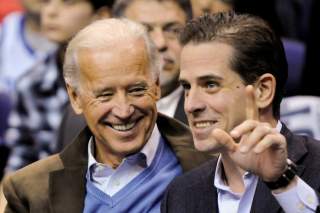 FILE PHOTO: In this file photo, former U.S. Vice President Joe Biden and his son Hunter Biden attend an NCAA basketball game between Georgetown University and Duke University in Washington, U.S., January 30, 2010. REUTERS/Jonathan Ernst/File Photo