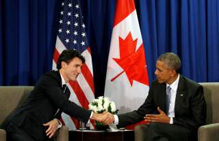 FILE PHOTO: U.S. President Barack Obama meets Canadian Prime Minister Justin Trudeau at the APEC Summit in Lima, Peru November 20, 2016. REUTERS/Kevin Lamarque/File Photo