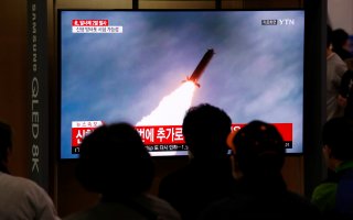 People watch a TV broadcast showing a file footage for a news report on North Korea firing two projectiles, possibly missiles, into the sea between the Korean peninsula and Japan, in Seoul, South Korea, October 31, 2019. REUTERS/Heo Ran