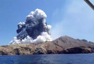 Smoke from the volcanic eruption of Whakaari, also known as White Island, is pictured from a boat, New Zealand December 9, 2019 in this picture grab obtained from a social media video. INSTAGRAM @ALLESSANDROKAUFFMANN/via REUTERS
