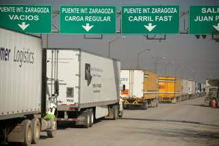 Trucks wait in a queue for border customs control, to cross into the U.S., at the Zaragoza-Ysleta border crossing bridge in Ciudad Juarez, Mexico December 12, 2019. REUTERS/Jose Luis Gonzalez