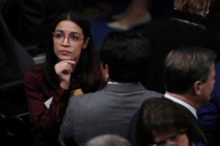 Rep. Alexandria Ocasio-Cortez reacts after voting on two articles of impeachment against U.S. President Donald Trump at the U.S. Capitol in Washington, U.S., December 18, 2019. REUTERS/Jonathan Ernst