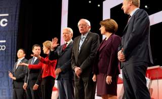 Former Vice President Joe Biden waves from among the seven Democratic presidential candidates...during the sixth 2020 U.S. Democratic presidential candidates campaign debate at Loyola Marymount University in Los Angeles, California, U.S.
