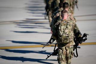 U.S. Army paratroopers assigned to the 1st Brigade Combat Team, 82nd Airborne Division, walk toward an awaiting aircraft prior to departing for the Middle East from Fort Bragg, North Carolina, U.S. January 5, 2020. REUTERS/Bryan Woolston/File Photo