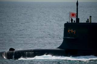 Sailors stand aboard the Kokuryu submarine of the Japanese Maritime Self-Defense Force (JMSDF) during its fleet review at Sagami Bay, off Yokosuka, south of Tokyo October 15, 2015. REUTERS/Thomas Peter
