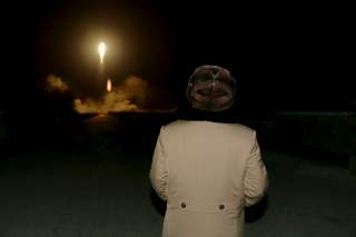 North Korean leader Kim Jong Un watches the ballistic rocket launch drill of the Strategic Force of the Korean People's Army (KPA) at an unknown location, in this undated photo released by North Korea's Korean Central News Agency (KCNA) in Pyongyang on Ma