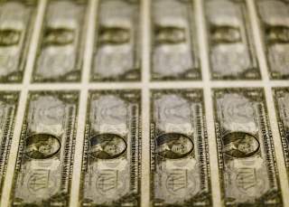 United States one dollar bills are seen on a light table at the Bureau of Engraving and Printing in Washington in this November 14, 2014, file photo. Dollar bulls were on the defensive on March 30, 2016 after Federal Reserve chair Janet Yellen's cautious 