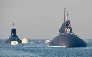 Russian submarines sail during a rehearsal for the Navy Day parade in the far eastern port of Vladivostok, Russia, July 30, 2016. REUTERS/Yuri Maltsev