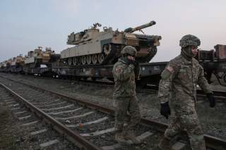 US soldiers walk next to M1 Abrams tanks at the Mihail Kogalniceanu Air Base, Romania, February 14, 2017. Inquam Photos/Octav Ganea/via 