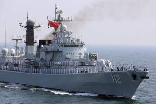 Chinese servicemen gesture from the deck of a naval vessel, during the closing ceremony of the Pakistan Navy’s Multinational Exercise AMAN-17, in the North Arabian Sea, Pakistan, February 14, 2017. REUTERS/Akhtar Soomro