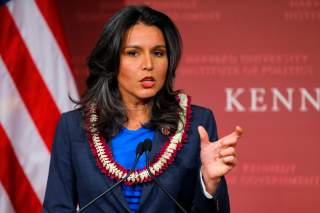 S. Representative Tulsi Gabbard (D-HI) speaks after being awarded a Frontier Award during a ceremony at the Kennedy School of Government at Harvard University in Cambridge, Massachusetts November 25, 2013. REUTERS/Brian Snyder