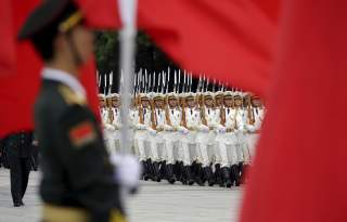 China's People Liberation Army (Navy) sailors from the honour guard march during a welcoming ceremony for Fiji's Prime Minister Josaia Voreqe Bainimarama outside the Great Hall of the People, in Beijing, July 16, 2015. REUTERS/Jason Lee
