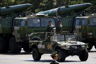Military vehicles carry DF-15B short-range ballistic missiles during the military parade to mark the 70th Anniversary of the end of World War Two, in Beijing, China, September 3, 2015. REUTERS/Damir Sagolj