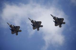  U.S. F-22 stealth fighter jets fly over Osan Air Base in Pyeongtaek, South Korea, February 17, 2016. REUTERS/Kim Hong-Ji TPX IMAGES OF THE DAY