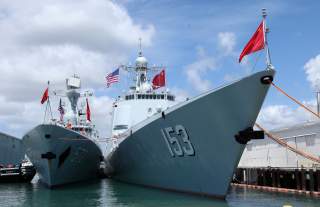 Chinese Peoples Liberation Army Naval Frigate Hengshui (L) is moored next to the PLAN ship Xi'an after arriving at the Joint Base Pearl Harbor Hickam to participate in the multi-national military exercise RIMPAC in Honolulu, Hawaii, June 29, 2016.