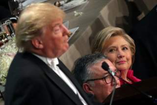 Democratic U.S. presidential nominee Hillary Clinton looks at Republican U.S. presidential nominee Donald Trump as he speaks during the Alfred E. Smith Memorial Foundation dinner in New York, U.S. October 20, 2016. REUTERS/Carlos Barria
