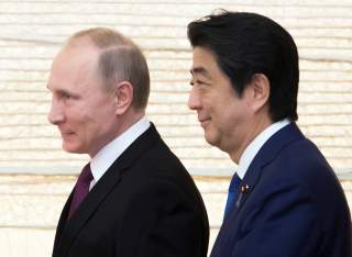 Vladimir Putin, Russia's president, and Shinzo Abe, Japan's prime minister, arrive for a working lunch at the prime minister's official residence in Tokyo, Japan, on Friday, Dec. 16, 2016. REUTERS/Tomohiro Ohsumi/Pool