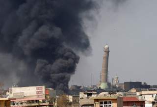 Smoke rises from clashes near Mosul's Al-Habda minaret at the Grand Mosque, where Islamic State leader Abu Bakr al-Baghdadi declared his caliphate back in 2014, as Iraqi forces battle to drive out Islamic state militants from the western part of Mosul, Ir