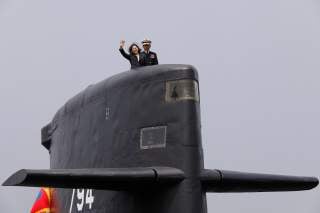 Taiwan President Tsai Ing-wen waves as she boards Hai Lung-class submarine (SS-794) during her visit to a navy base in Kaohsiung, Taiwan March 21, 2017. REUTERS/Tyrone Siu TPX IMAGES OF THE DAY