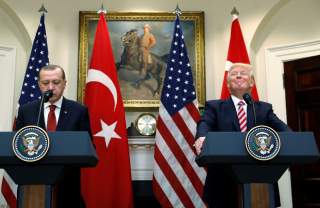 Turkey's President Recep Tayyip Erdogan (L) and U.S President Donald Trump deliver statements to reporters in the Roosevelt Room of the White House in Washington, U.S. May 16, 2017. REUTERS/Kevin Lamarque TPX IMAGES OF THE DAY