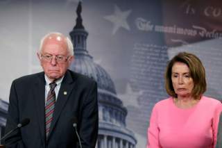 U.S. House Minority Leader Nancy Pelosi (D-CA) and Sen. Bernie Sanders (I-VT) react during a news conference on release of the president's FY2018 budget proposal on Capitol Hill in Washington, U.S., May 23, 2017. REUTERS/Yuri Gripas TPX IMAGES OF THE DAY