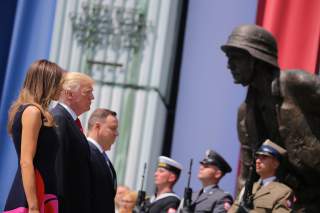 First Lady of the U.S. Melania Trump, U.S. President Donald Trump and Polish President Andrzej Duda stand in front of the Warsaw Uprising Monument at Krasinski Square, in Warsaw, Poland July 6, 2017. REUTERS/Carlos Barria