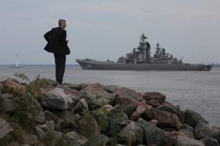 A man looks at the Russian nuclear missile cruiser Pyotr Veliky (Peter the Great) on the eve of the Navy Day parade in Kronshtadt, a seaport town in the suburb of St. Petersburg, Russia, July 28, 2017.